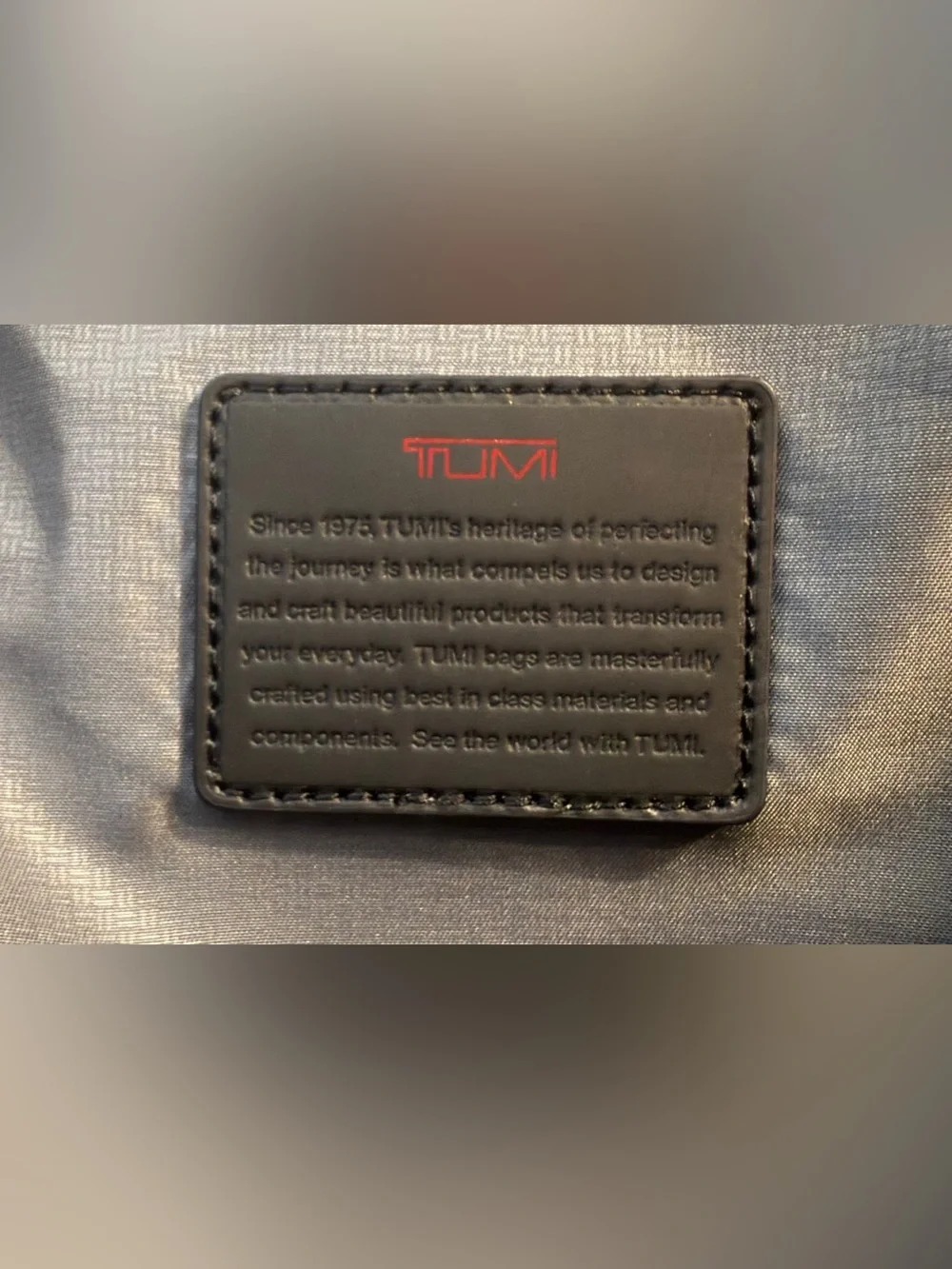 Tumi impressive 13